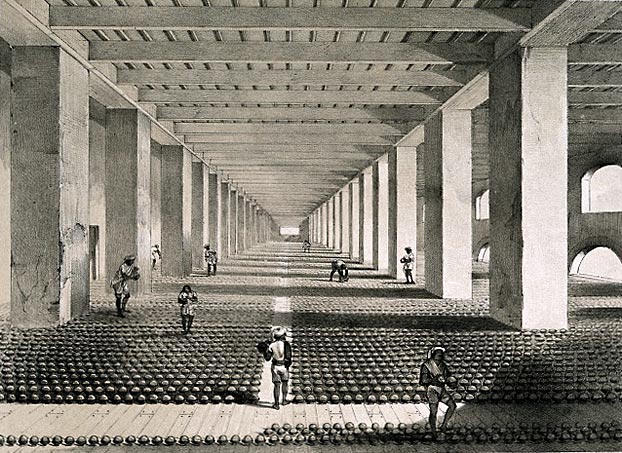 La Compagnie des Indes orientales a construit de gigantesques usines entièrement dédiées à la transformation de l'opium en pavot. Cette litographie du XIXe siècle resprésente un atelier de séchage dans la ville de Patna, au nord-est de l'Inde. © W. S. Sherwill – Visualizing Cultures/Massachusetts Institute of Technology