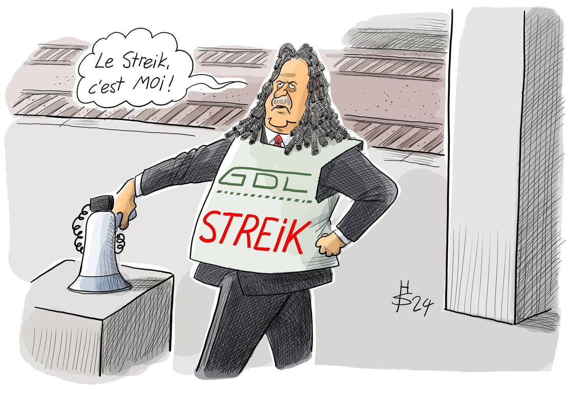 Streik, à traduire par grève. Une caricature du président de GDL, Claus Weselsky.